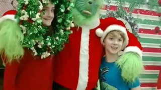 Wear the wreath photo prop at a Christmas party in Katy TX with the Grinch