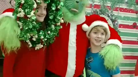 Wear the wreath photo prop at a Christmas party in Katy TX with the Grinch