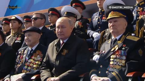 Russian Defense Minister Shoigu proceeds toward the center of Red Square.