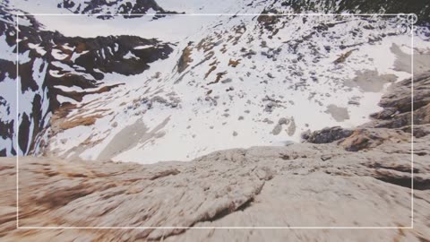 Drone Footage Of A Mountain Landscape With Snow