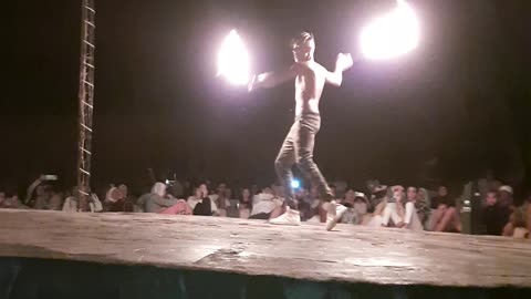 Guy amazingly control two fire swords