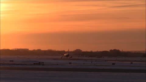 An Airplane Taxiing On An Airport Ground