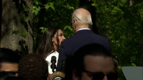 Joe Biden Getting Guided To Stage Exit By AOC