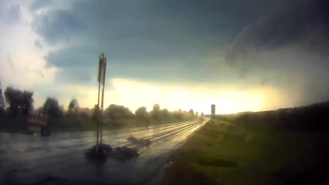 Speeding Vehicle Almost Crashed Into a Sign on the Road as It Rains