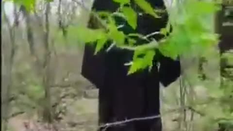 Ukrainian soldiers hanging an Orthodox priest