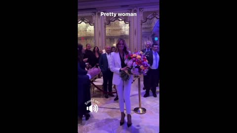 Melania Drops Jaws in Gorgeous White Pantsuit, Serenaded with 'Pretty Woman' as She Walks into Room