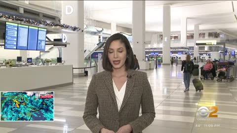 Frustrated faces make their way through LaGuardia Airport