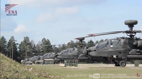 Apache Longbow attack helicopter weapon loading and artillery training