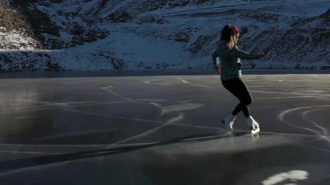 ICE SKATING ON A FROZEN LAKE - FRANCE