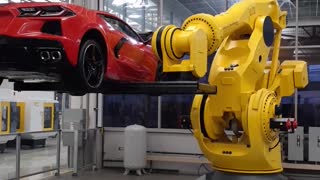 FANUC robot tossing a Corvette around