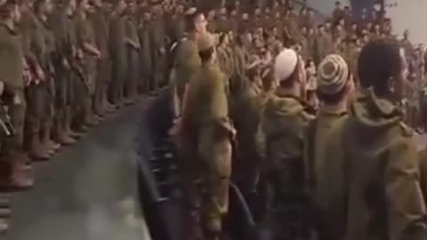 Israeli servicemen praying before another combat strikes