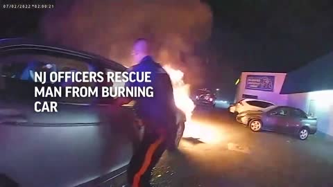 New Jersey police rescue man from burning car