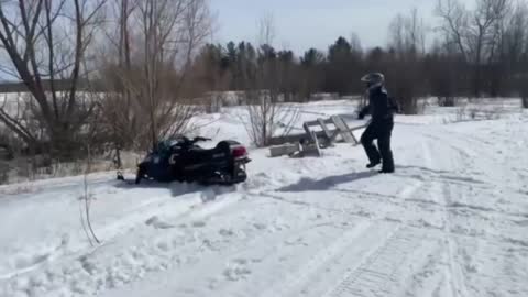 Guy Jumps Over A Car With A Snowmobile But He Lands On Top Of It
