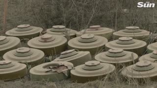 Ukrainian servicemen carefully remove landmines in the Kherson region