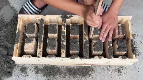 Casting Five Hole Bricks With Connectors At The Same Time From Wood & ement Mold