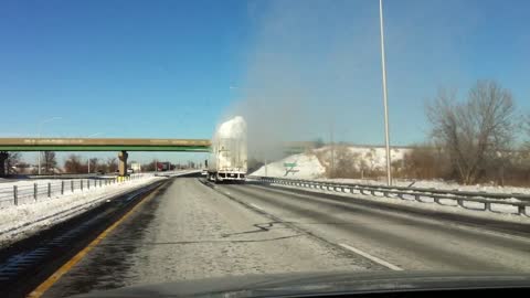 Surplus Of Snow Explodes As Truck Passes Under Bridge