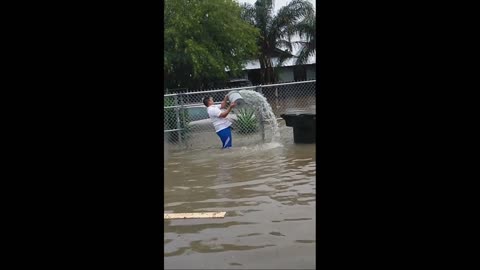 Guy Fails to Stop Flash Flood With Bucket
