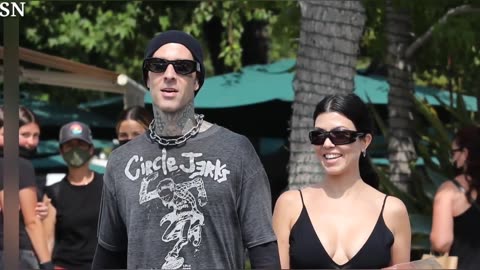 Pregnant Kourtney Kardashian Snuggles Up to Husband Travis Barker in Sweet New Photo