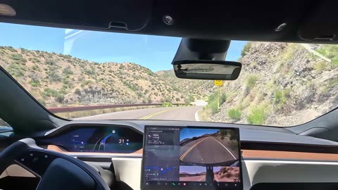 Tesla Full Self Driving Beta 11.4.3 FSD holding a curvy road