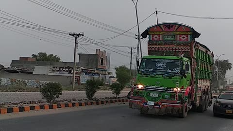 Green cabin PKD truck local Pakistani decorated truck