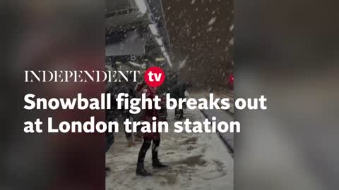Snowball fight breaks out at London train station