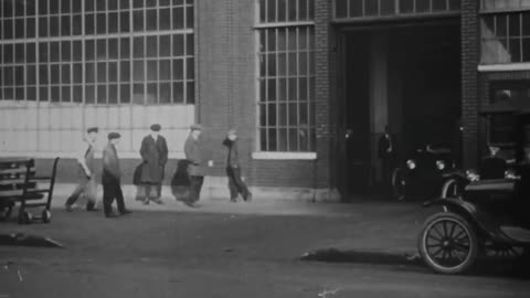 Cars are manufactured on an assembly line in 1918 at the Ford Motor Company short video no