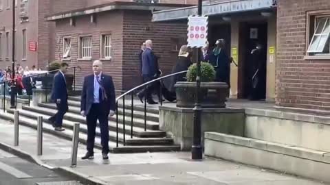 CRIMINAL HILLARY CLINTON BOOED OUTSIDE OF QUEEN'S UNIVERSITY WHILE CHILD HOLDS HER GOWN