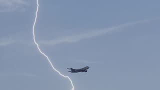 The lightning thundering raining plane flight