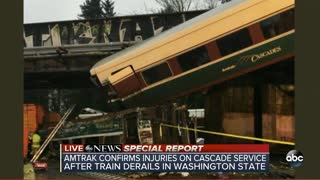 SPECIAL REPORT | Amtrak train car dangling over Washington interstate after derailment