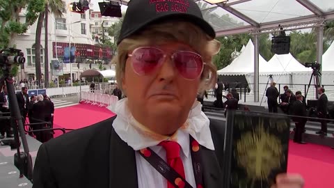 Camera operator dons Trump outfit on Cannes red carpet