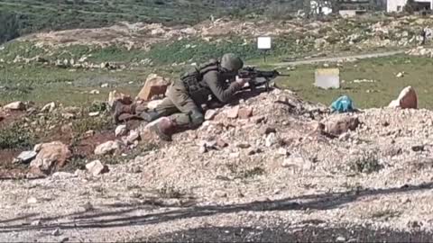 ISRAEL – An Israeli sniper prepared to intervene during clashes