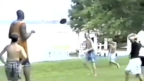 Kids playing football in a park in the year 1995