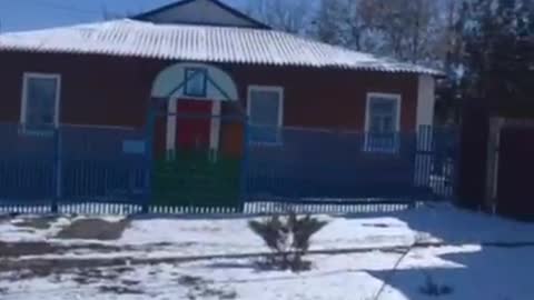 The flags of the LPR and the Russian Federation are raised over the administration of the village