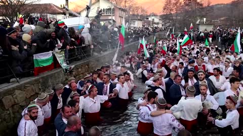 Bulgarians celebrate Epiphany in an icy river