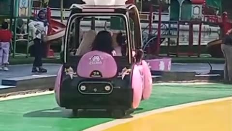 Kiddos Riding a Toy Car at Rainbow Alamanda Funpark