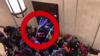 Guy wearing an earpiece physically forcing people inside the Capitol J6