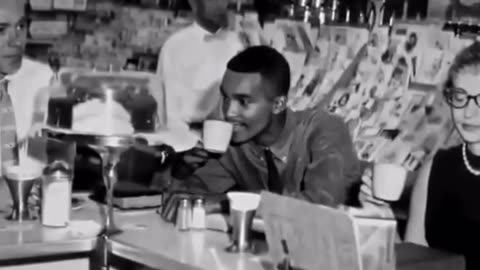 Civil rights activist reacts to food after finally being served at "white only" restaurant