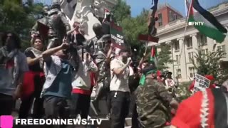 BREAKING: A Hamas protester holds up a bloody mask depicting Biden. Another...