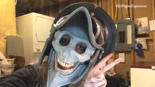 Girl in blue skull pirate mask