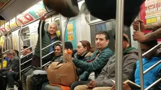 Subway dancers do hat flip tricks and spin around on poles