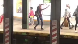 Blonde woman striped shirt dance on subway platform