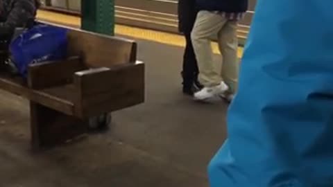 Couple slow dances at subway station