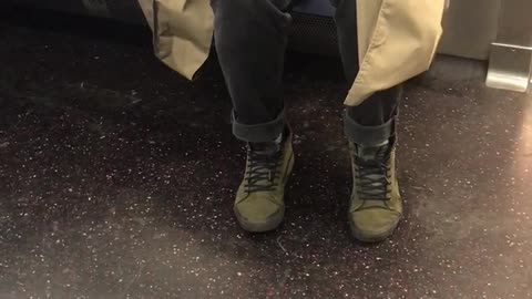 Guy throws his fingernail clippings on subway floor
