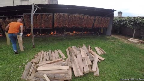 Ten Huge Grills Roast Giant Asado. Crazy Street Food Festival in Italy