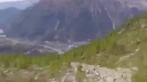 WINGSUIT FLYING THROUGH THE GLACIER