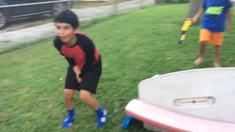 Kid Destroys Picnic Table With Epic Swing Set Jump
