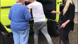 Girl puts her elderly grandparents in large neon yellow suv