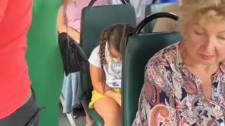 Little girl generously gives up her seat with a smile