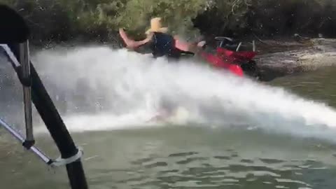 Guy gets knocked down by jet ski