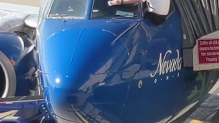 Airline Pilots Manually Wipe Windshield before Flight